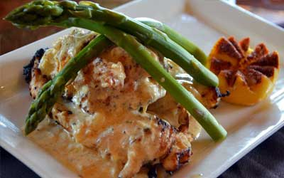 chicken breast topped with lump crab meat. Chicken Oscar